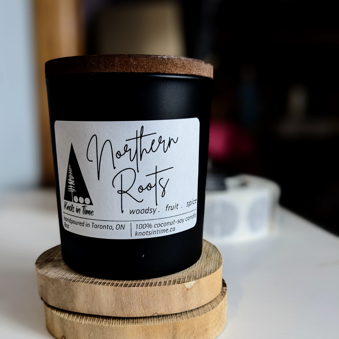 8oz candle with label on a wood slice