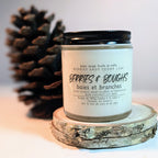 Candle labeled 'Berries & Boughs' with a pine cone in the background