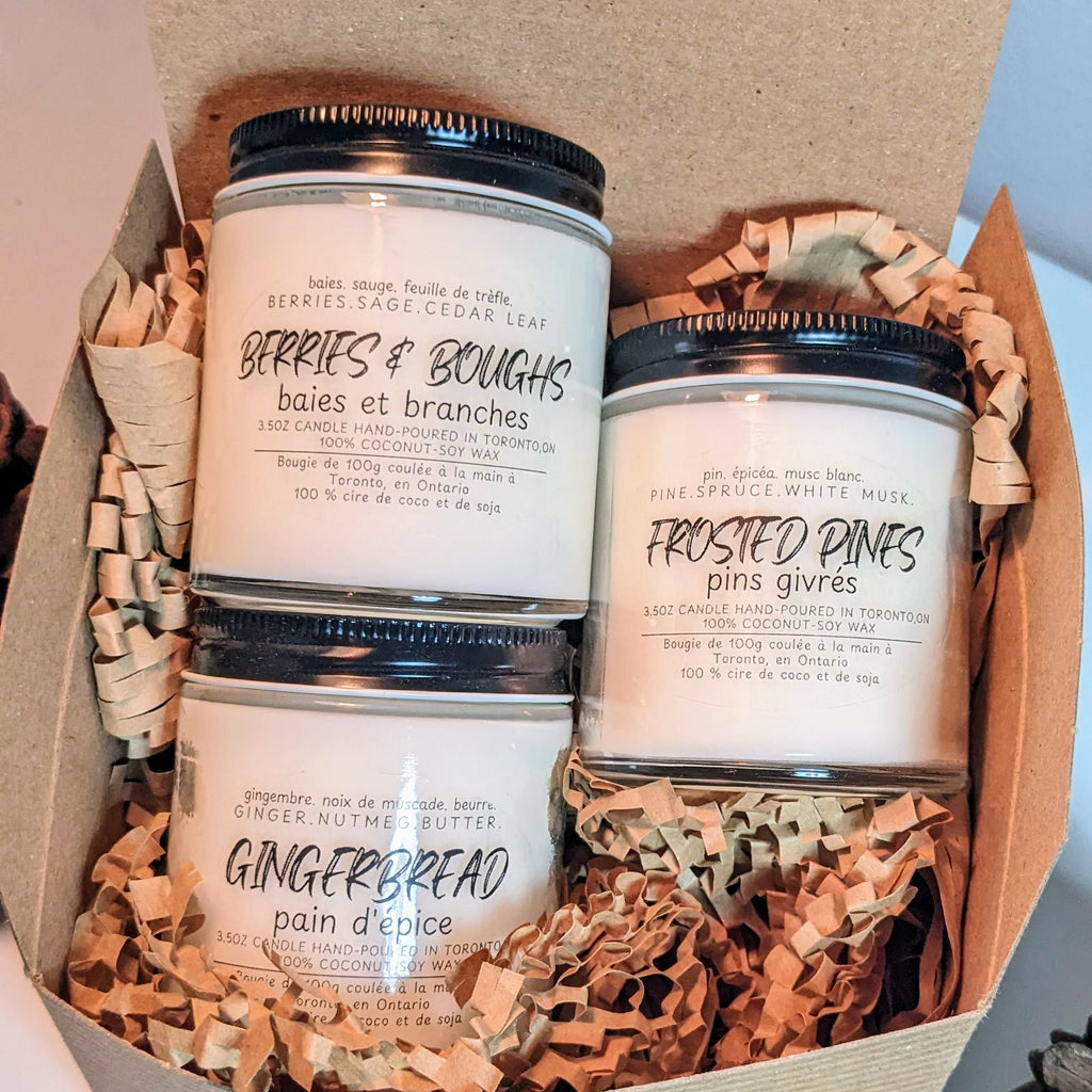 Three candles in a box with decorative paper