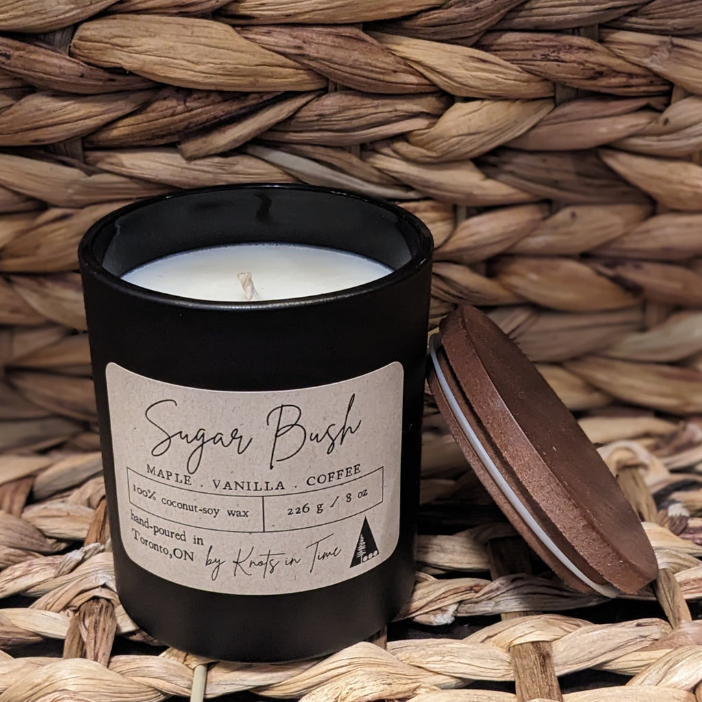 Candle with a label on a woven surface